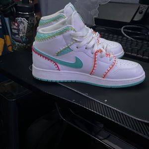 Air Jordan mid SE white base with teal orange and green